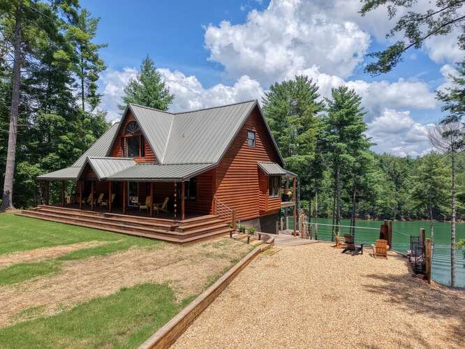 514 Browns Cove Road Blue Ridge, GA 30513 - Photo 61 of 77 a view of a house with a yard and roof
