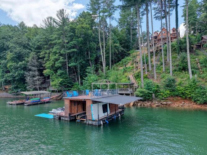 514 Browns Cove Road Blue Ridge, GA 30513 - Photo 66 of 77 a aerial view of a house with swimming pool a patio and lake view