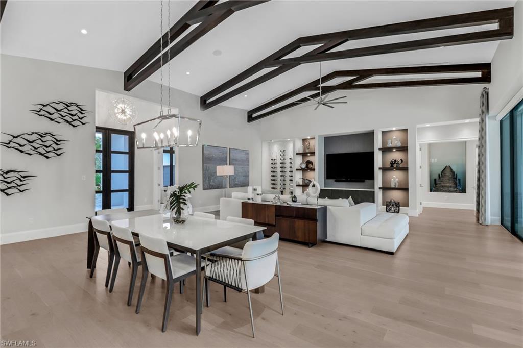 12 Banyan Road Naples, FL 34108 - Photo 16 of 50 a view of a livingroom with furniture and a flat screen tv