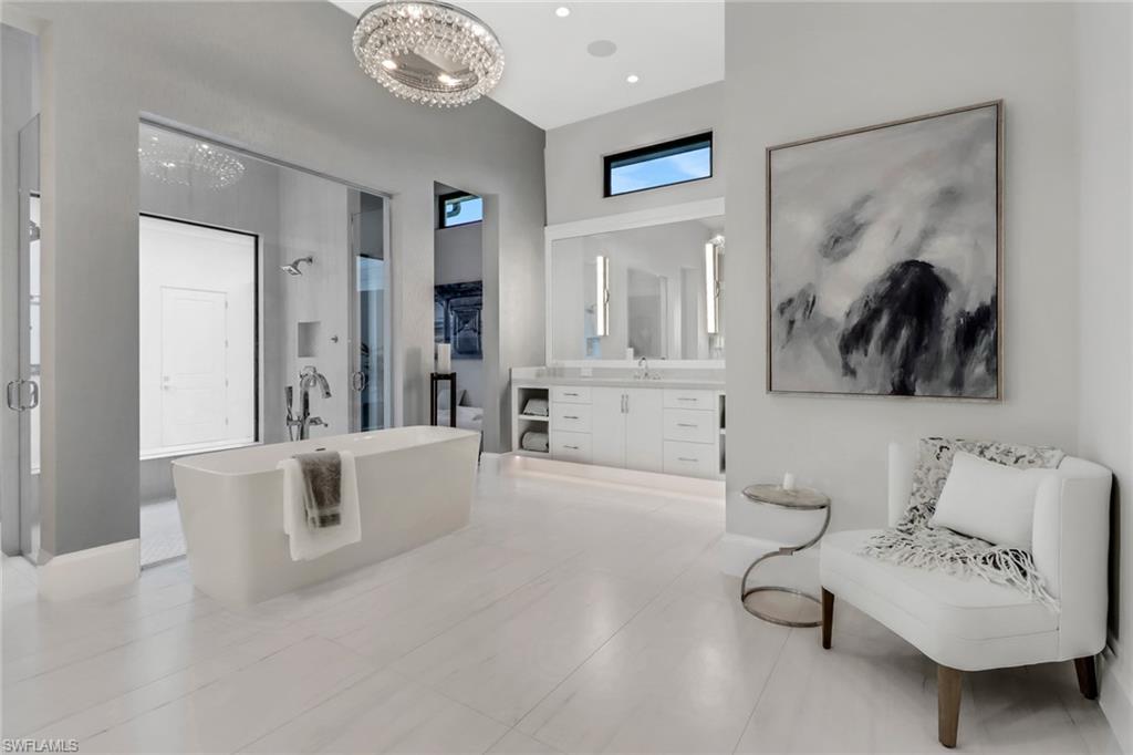 12 Banyan Road Naples, FL 34108 - Photo 23 of 50 a living room with furniture and a chandelier