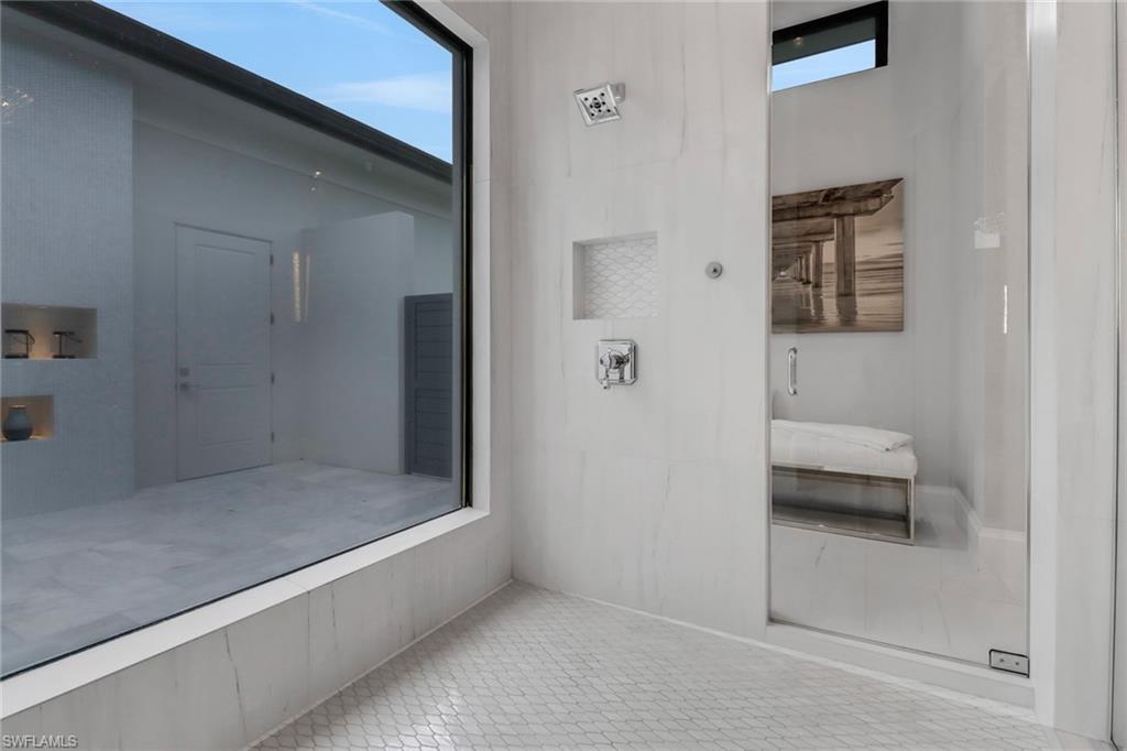 12 Banyan Road Naples, FL 34108 - Photo 25 of 50 a bathroom with a bathtub