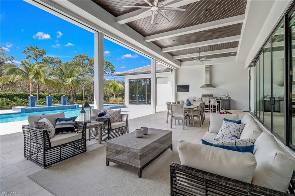 12 Banyan Road Naples, FL 34108 - Photo 43 of 50 a living room with furniture and a large window