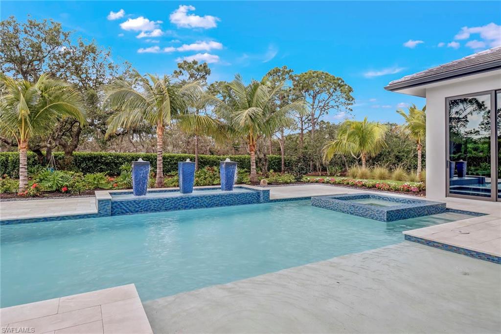 12 Banyan Road Naples, FL 34108 - Photo 45 of 50 a view of a building with a big yard