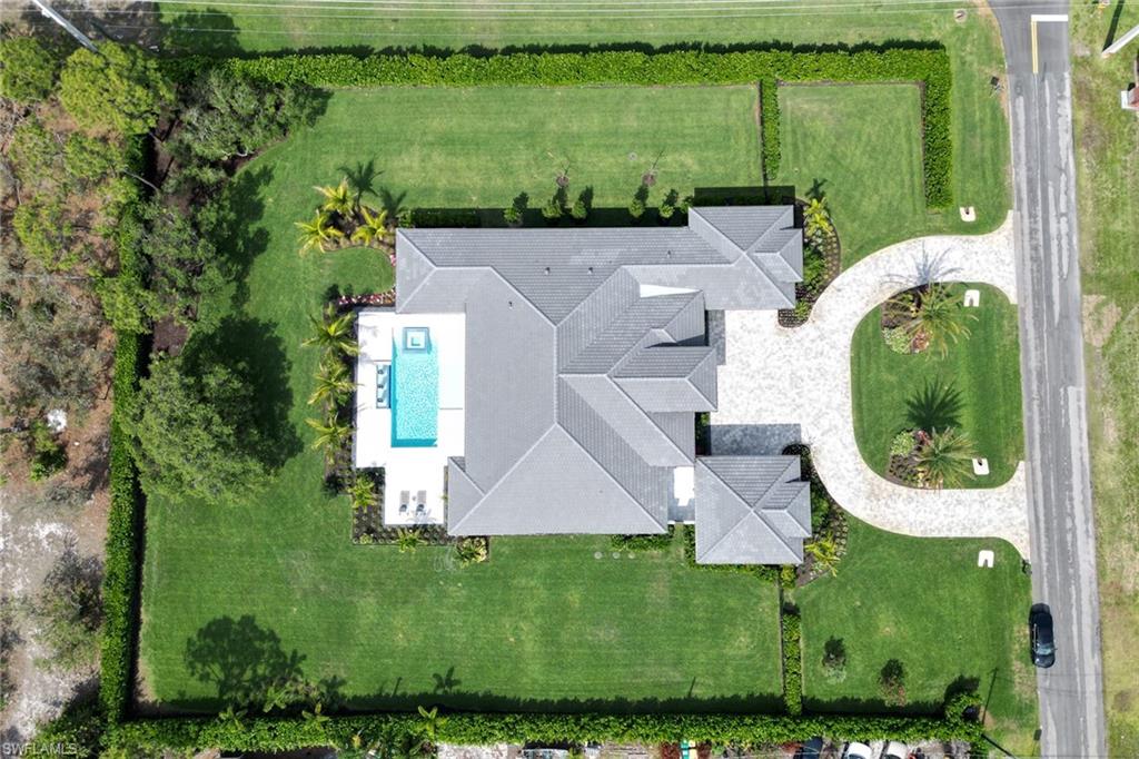 12 Banyan Road Naples, FL 34108 - Photo 50 of 50 an aerial view of a house with outdoor space and a lake view