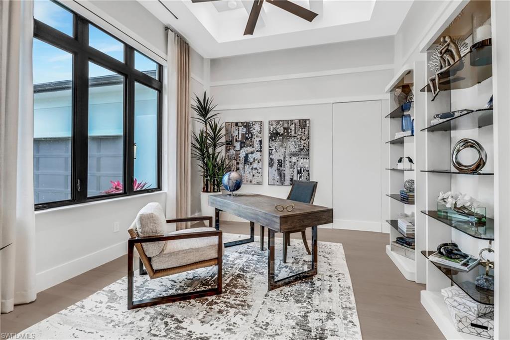 12 Banyan Road Naples, FL 34108 - Photo 5 of 50 a living room with furniture and a window