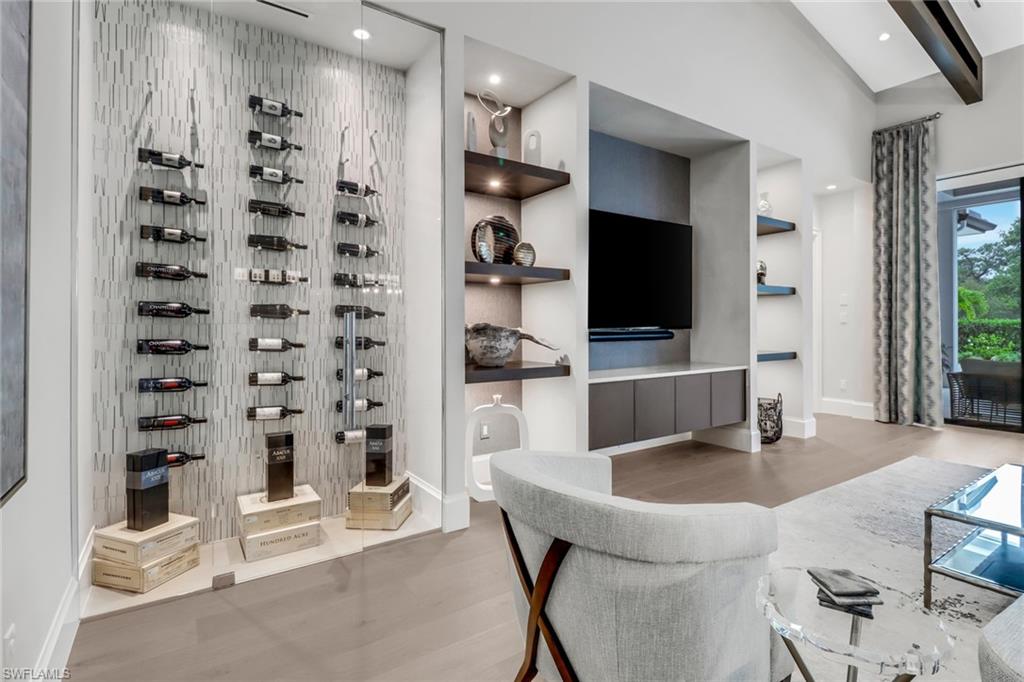 12 Banyan Road Naples, FL 34108 - Photo 9 of 50 a kitchen with a refrigerator and a sink