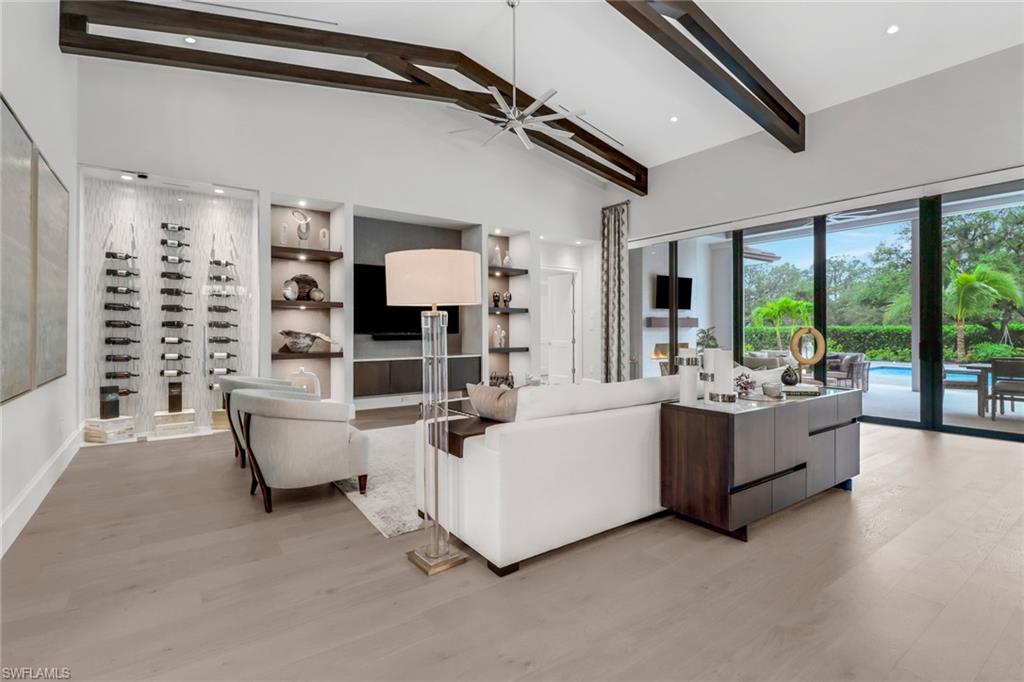 12 Banyan Road Naples, FL 34108 - Photo 10 of 50 a living room with furniture and a large window