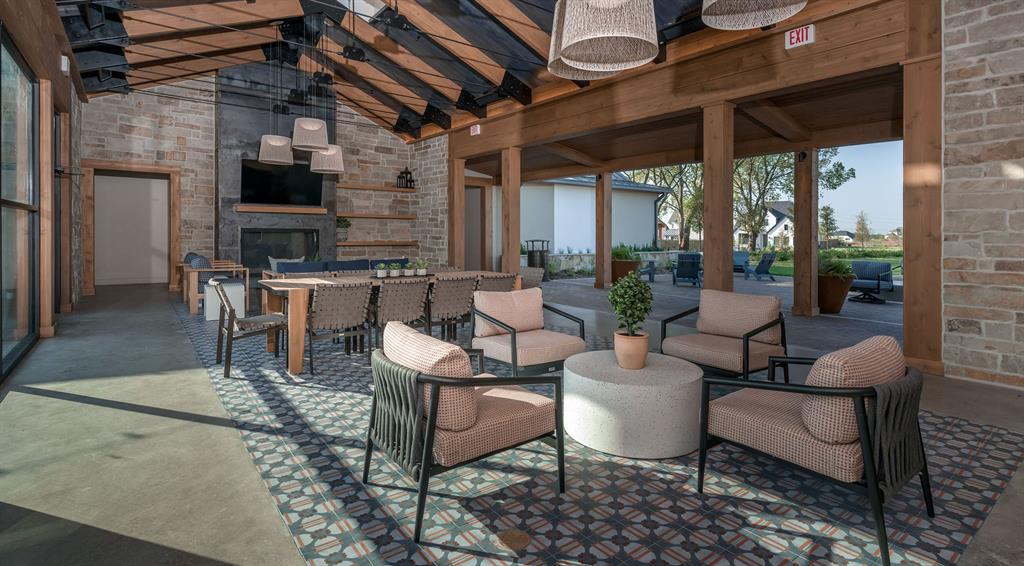 811 River Sky Road Lavon, TX 75166 - Photo 14 of 18 a outdoor space with couches a fireplace and a counter top space