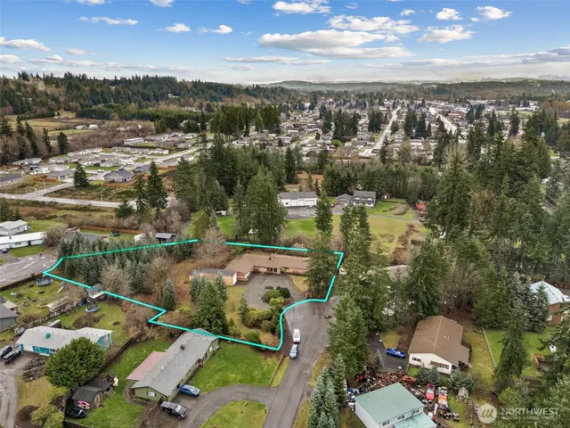 an aerial view of residential houses with outdoor space