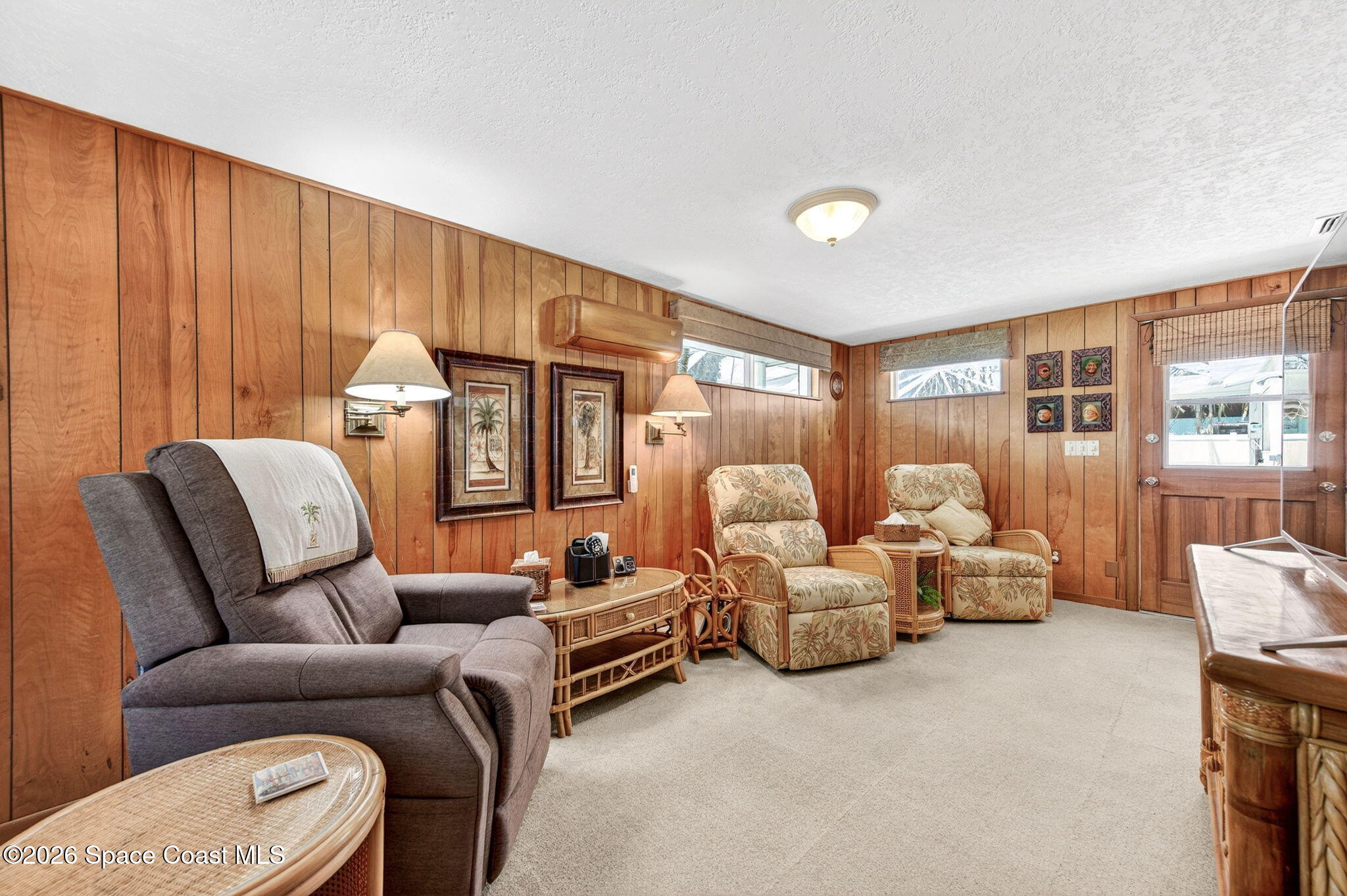 935 Samar Road Cocoa Beach, FL 32931 - Photo 3 of 22 a living room with furniture and a large window