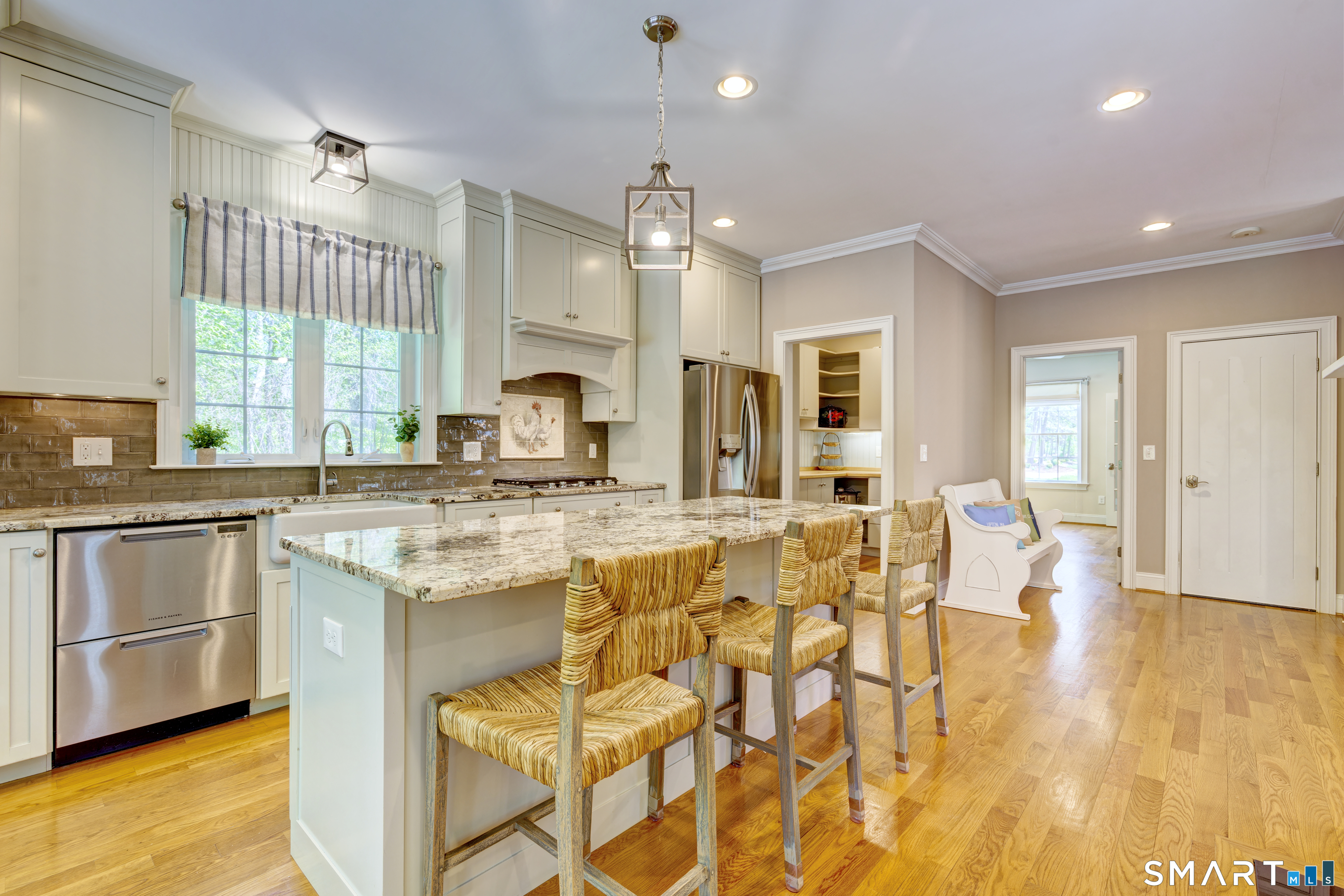 15 Tryon Farm Road Glastonbury, CT 06073 - Photo 13 of 40 Bright, Open Kitchen With Granite Countertops, a Large Center Island, and Stainless Steel Appliances