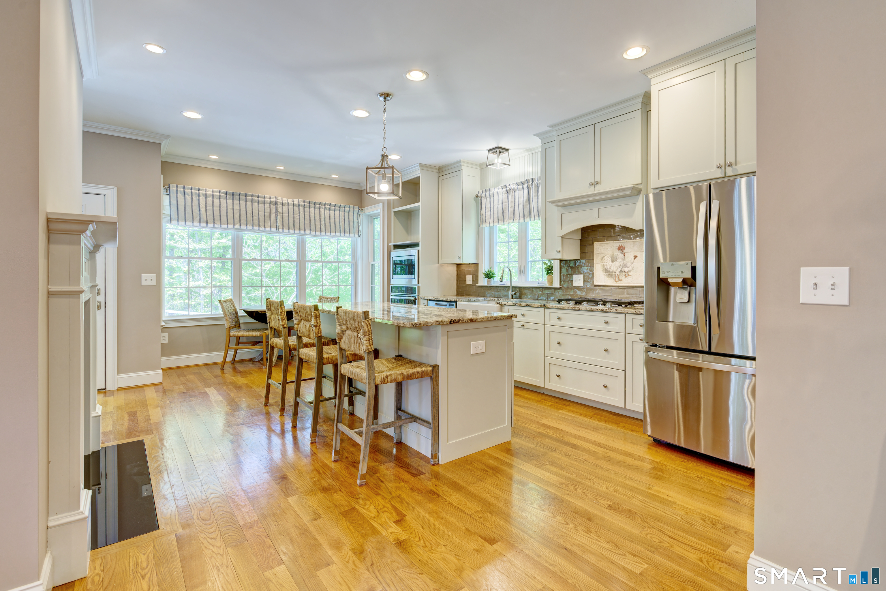 15 Tryon Farm Road Glastonbury, CT 06073 - Photo 14 of 40 Hardwood Floors Extend Throughout the Kitchen, Adding Warmth and Continuity