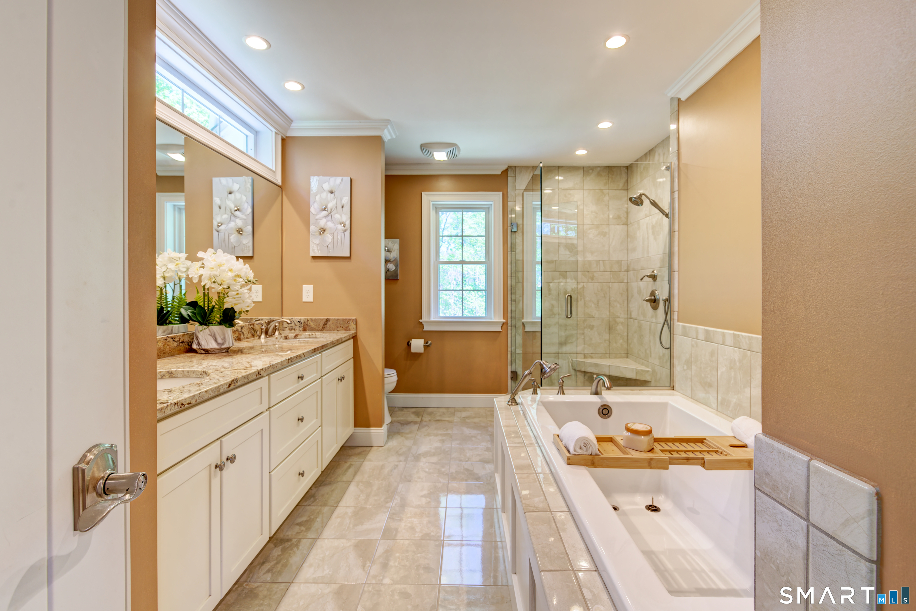 15 Tryon Farm Road Glastonbury, CT 06073 - Photo 24 of 40 Spacious En-Suite Bath Featuring a Double Vanity, Tile Shower, and Soaking Tub