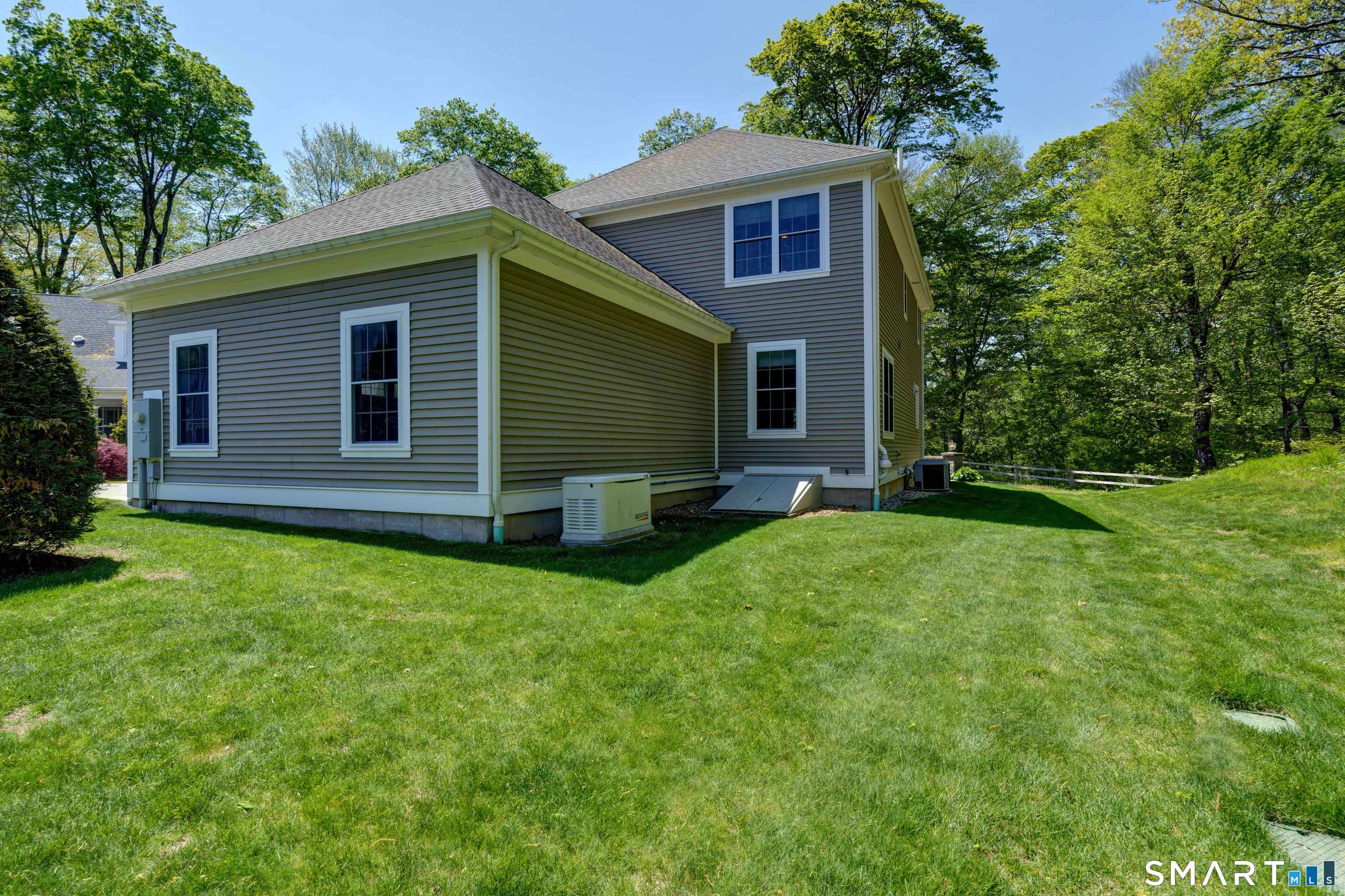 15 Tryon Farm Road Glastonbury, CT 06073 - Photo 7 of 40 A Whole-House Generator and a Rear Hatchway Add Convenience and Functionality