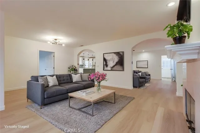 an empty room with furniture and a fireplace