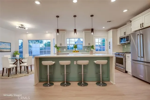 a view of a kitchen with a sink and a kitchen view