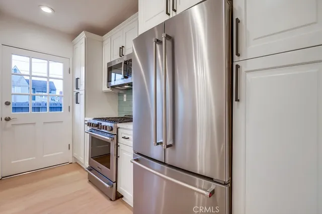a bathroom with a toilet and a shower curtain
