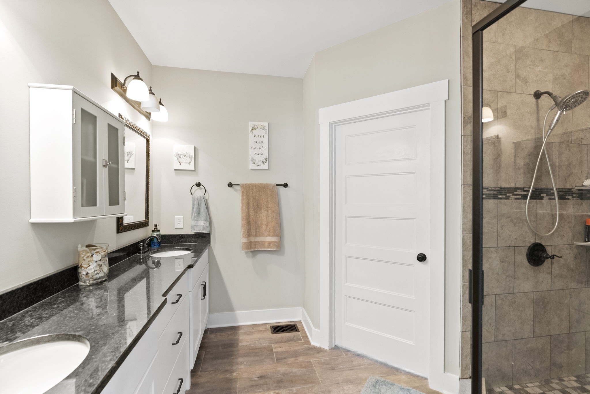 2764 New Hall Road Greenbrier, TN 37073 - Photo 21 of 44 a bathroom with a granite countertop sink a mirror and shower