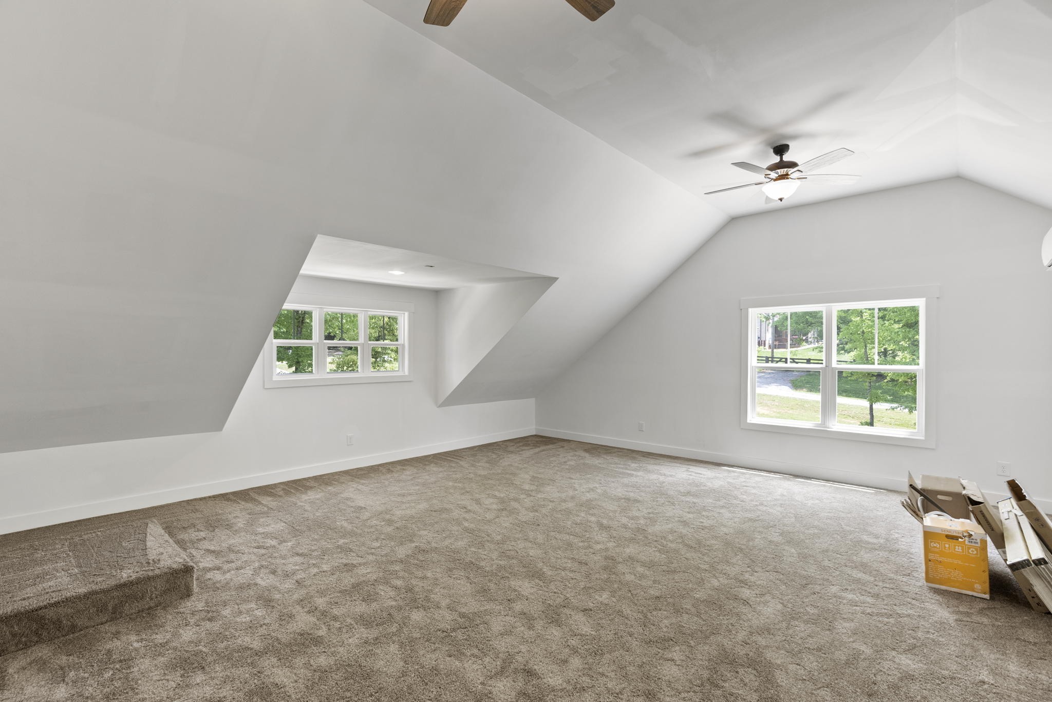 2764 New Hall Road Greenbrier, TN 37073 - Photo 23 of 44 an empty room with a window and a ceiling fan