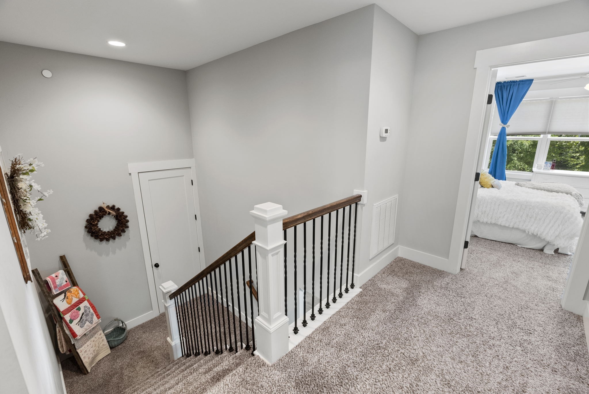 2764 New Hall Road Greenbrier, TN 37073 - Photo 24 of 44 a view of a hallway to a livingroom with furniture and staircase