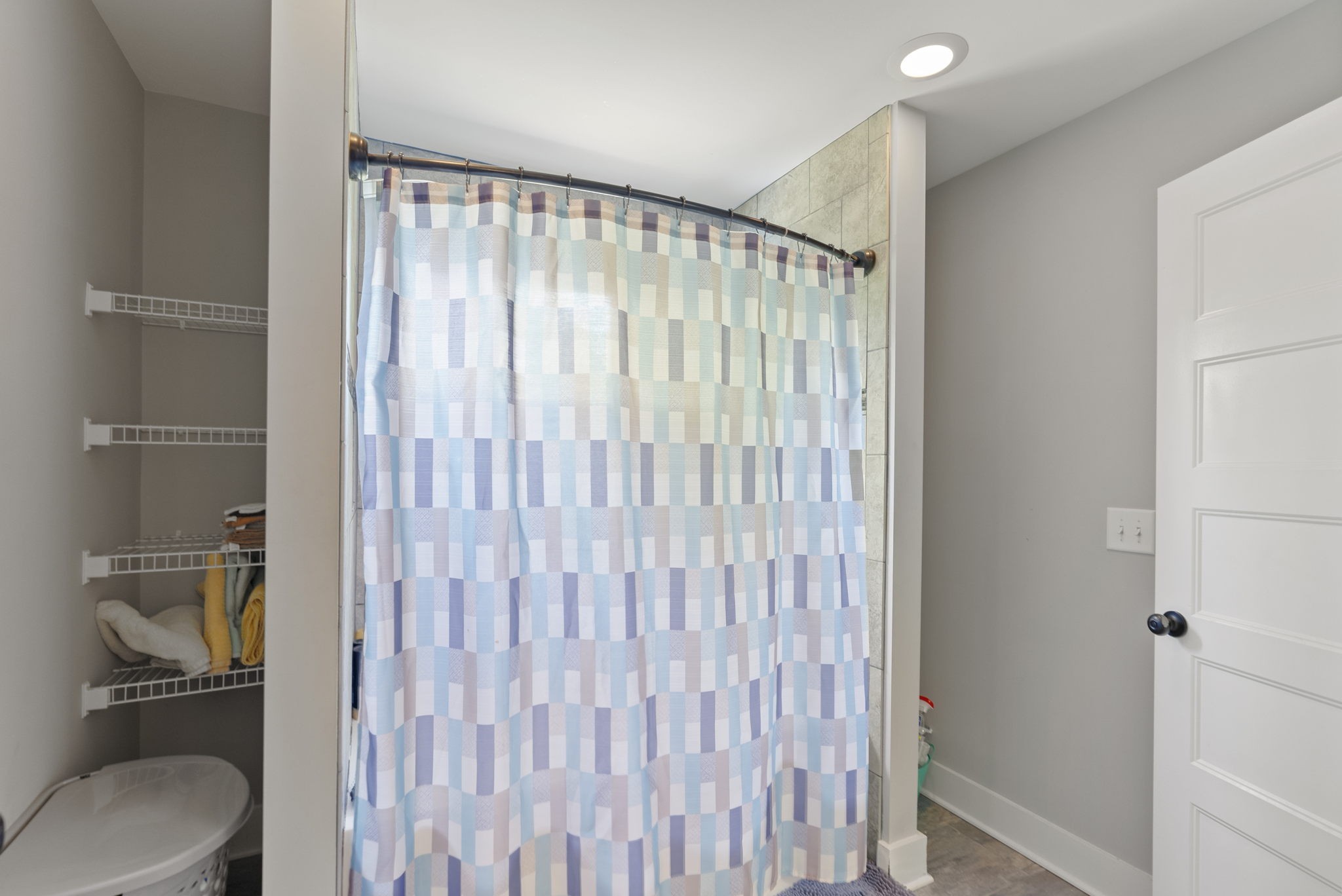 2764 New Hall Road Greenbrier, TN 37073 - Photo 31 of 44 a bathroom with a toilet and a shower curtain