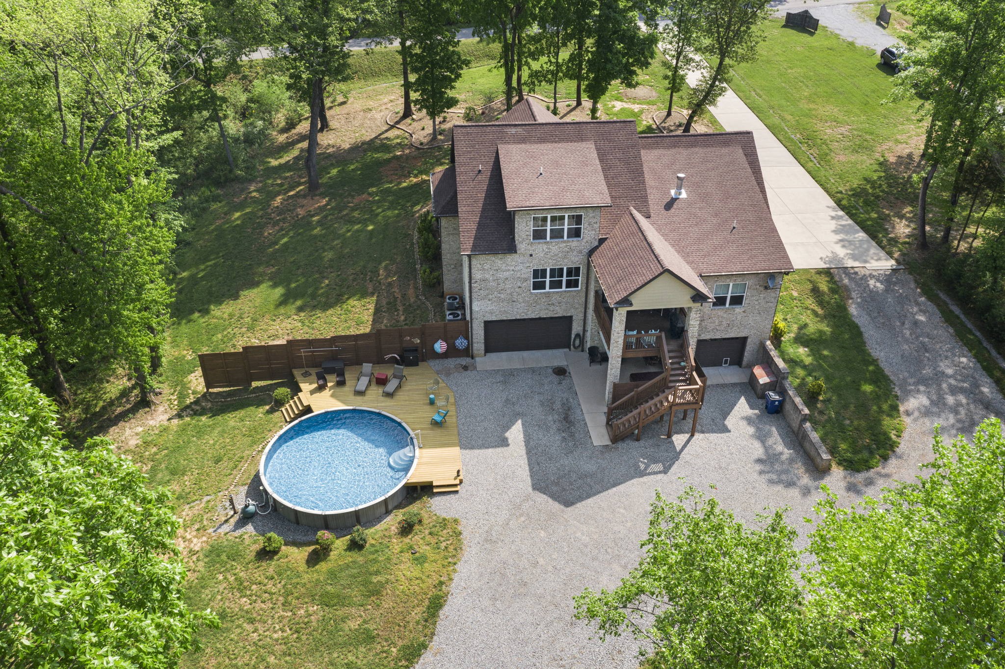 2764 New Hall Road Greenbrier, TN 37073 - Photo 44 of 44 an aerial view of a house with yard and trees all around