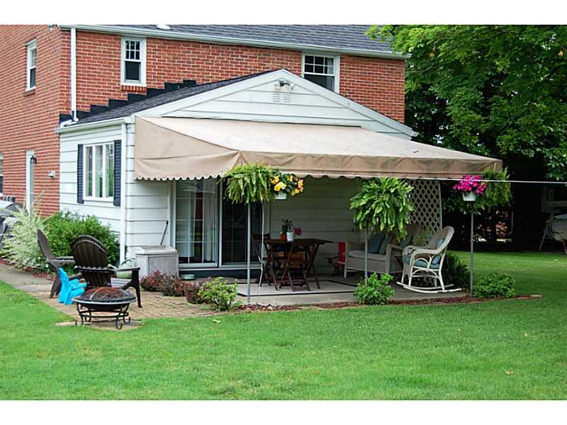 412 Nichols Road Pittsburgh, PA 15237 - Photo 4 of 25 Patio/Deck. *AWNING COVERED PATIO. PERFECT FOR DINING AL FRESCO OR SUMMER PICNICS.