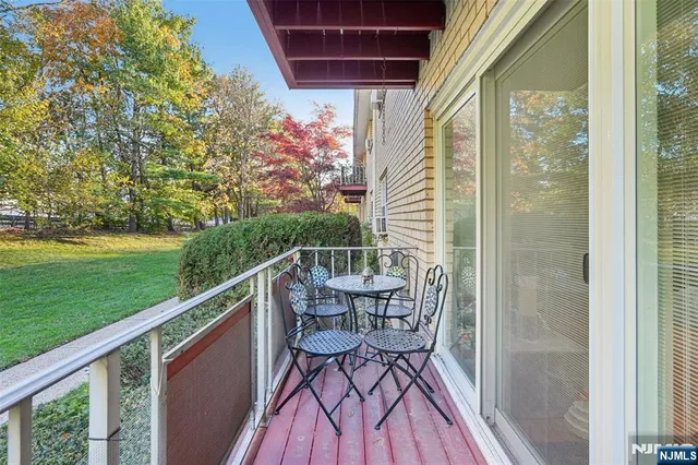 a view of balcony with furniture