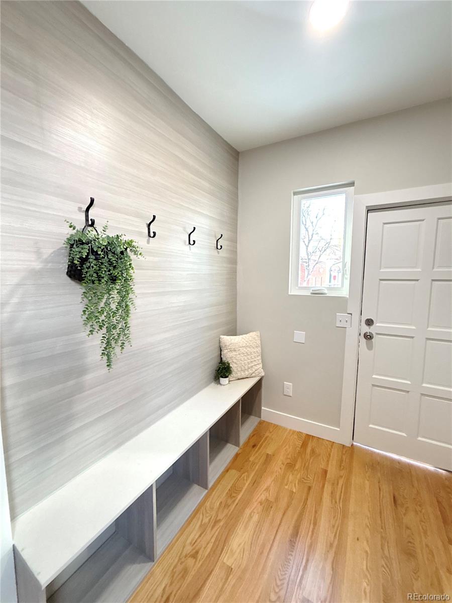 1129 Fillmore Street Denver, CO 80206 - Photo 11 of 32 a view of room with window and wooden floor