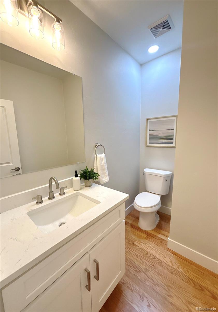1129 Fillmore Street Denver, CO 80206 - Photo 12 of 32 a bathroom with a sink and a toilet