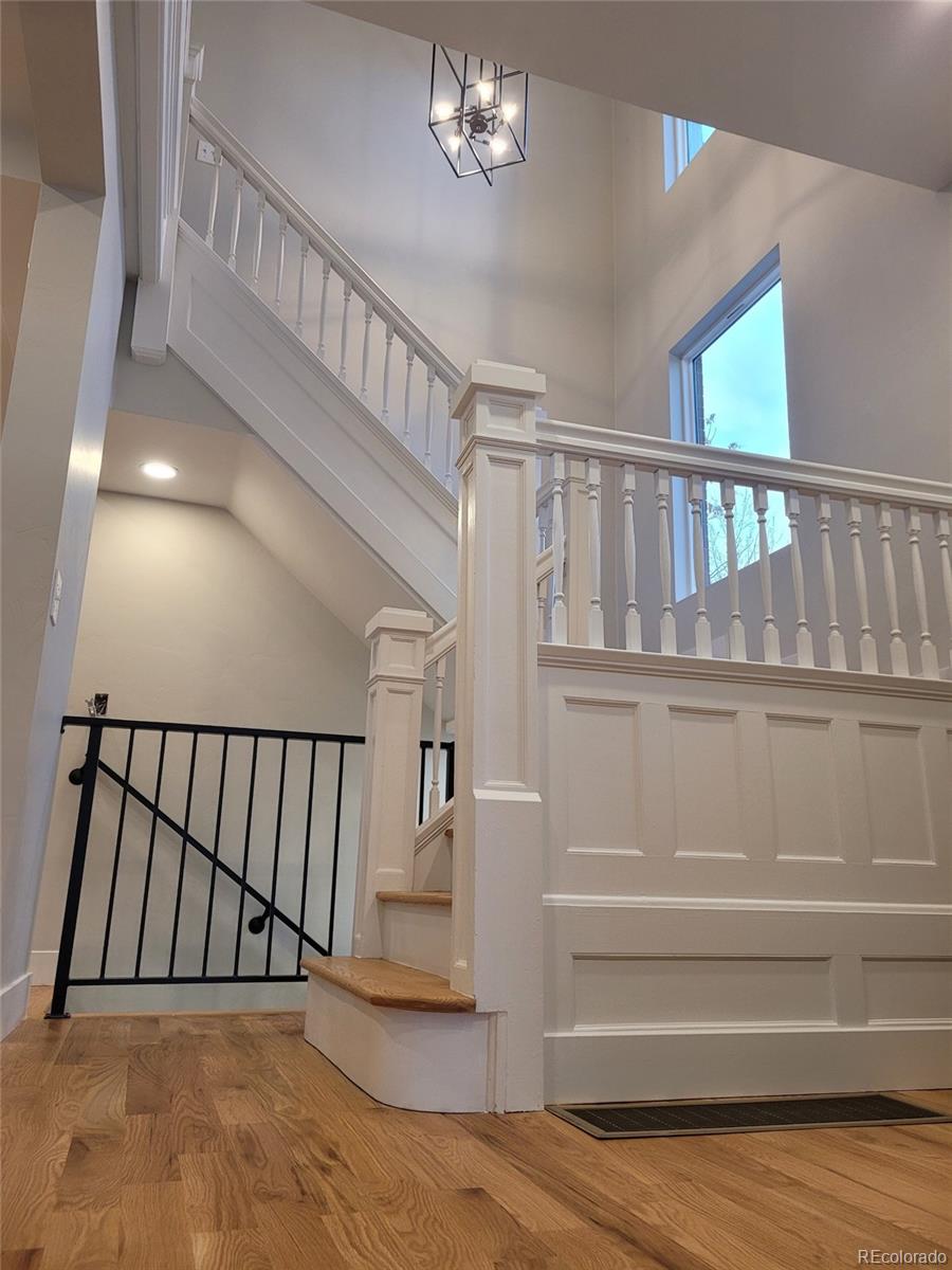 1129 Fillmore Street Denver, CO 80206 - Photo 13 of 32 a view of staircase with white walls and window
