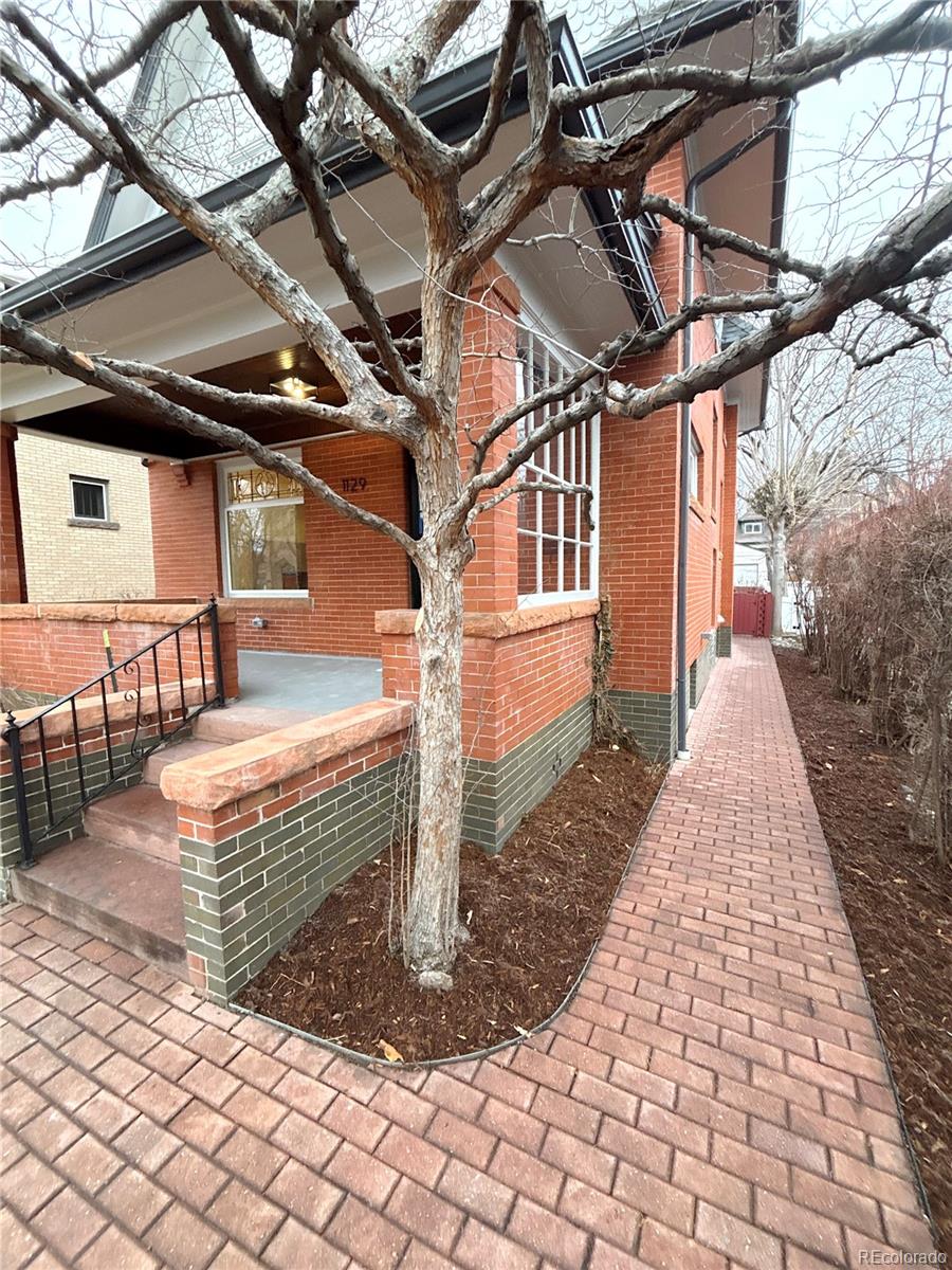 1129 Fillmore Street Denver, CO 80206 - Photo 28 of 32 a view of a porch with a bench