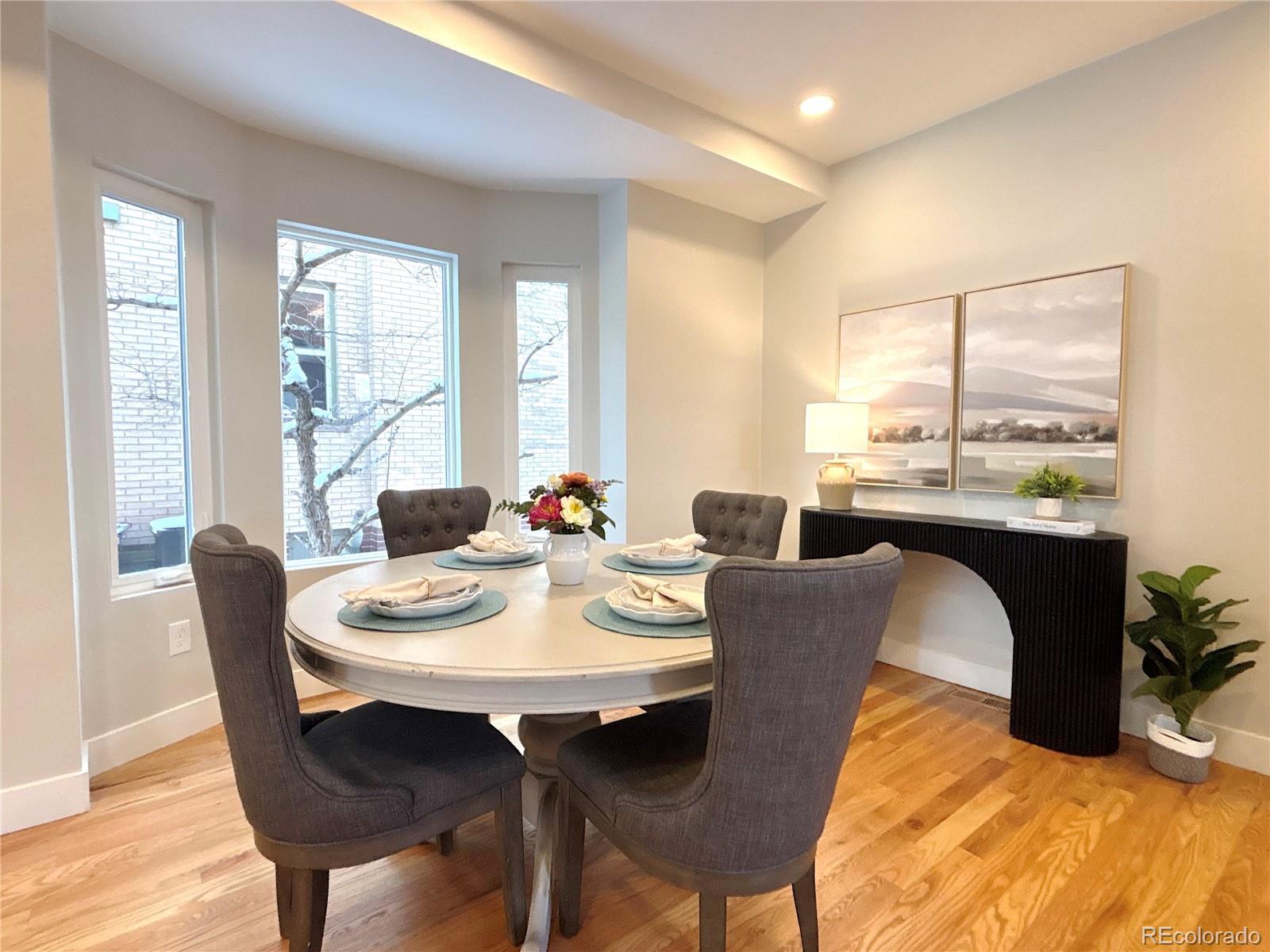 1129 Fillmore Street Denver, CO 80206 - Photo 4 of 32 a view of a dining room with furniture and window