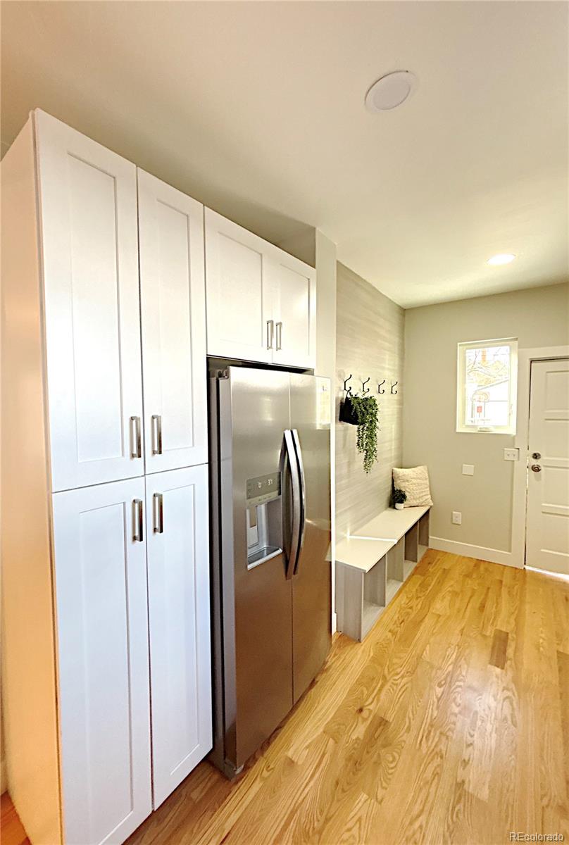 1129 Fillmore Street Denver, CO 80206 - Photo 9 of 32 a kitchen with a refrigerator sink and cabinets