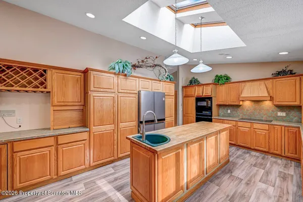 a front view of a building with parking area