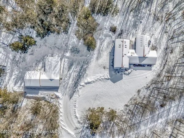 a view of a backyard of the house