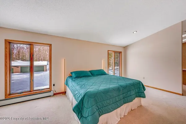 a kitchen with stainless steel appliances granite countertop a sink and a refrigerator