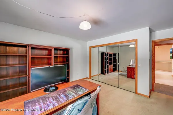 a view of a white house covered in snow