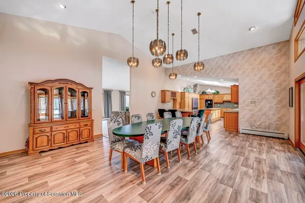 a kitchen with stainless steel appliances granite countertop a sink counter space cabinets and a large window