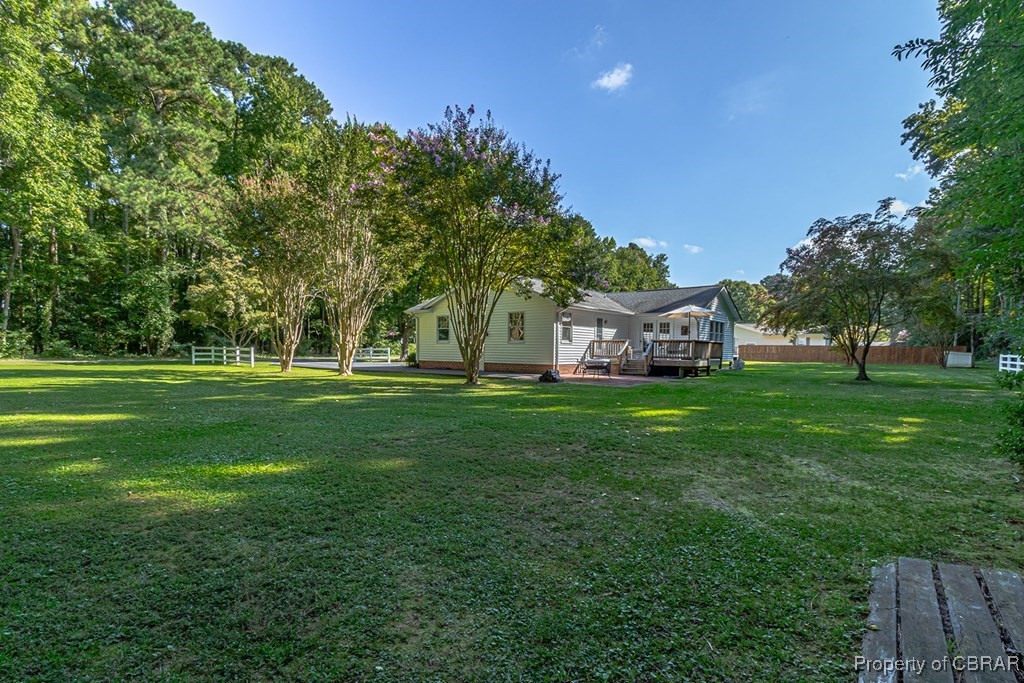 35 Powhatan Road Kilmarnock, VA 22482 - Photo 39 of 42 View of yard featuring a wooden deck