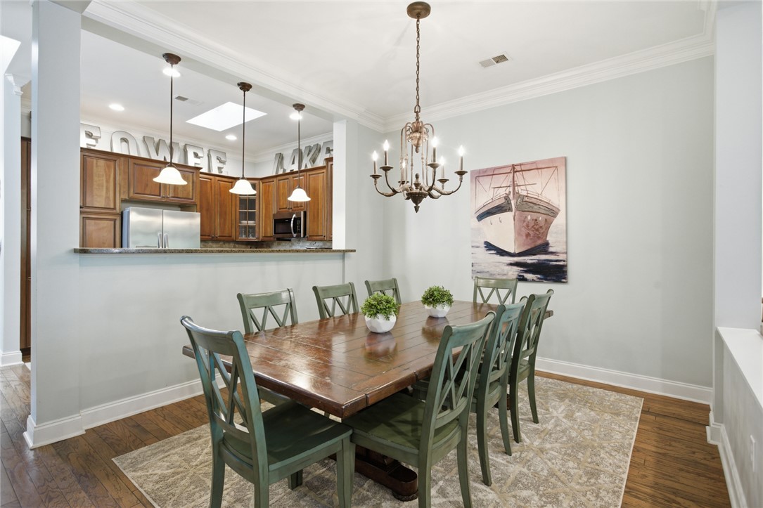 578 Sunset Point Drive West Union, SC 29696 - Photo 6 of 46 This dining room offers a comfortable atmosphere with warm wood floors and ample natural light.
