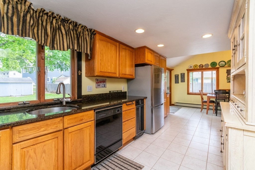 118 Bruce Road Walpole, MA 02081 - Photo 3 of 30 a kitchen with stainless steel appliances granite countertop a stove a sink dishwasher and a refrigerator