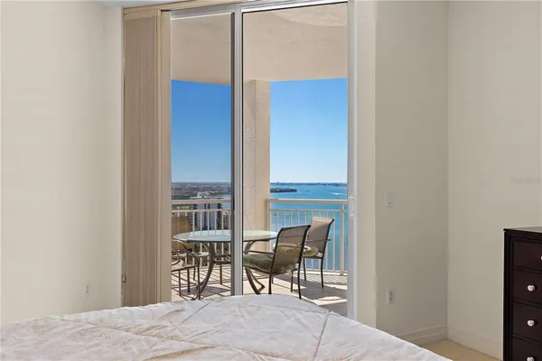 a dining room with furniture and a window