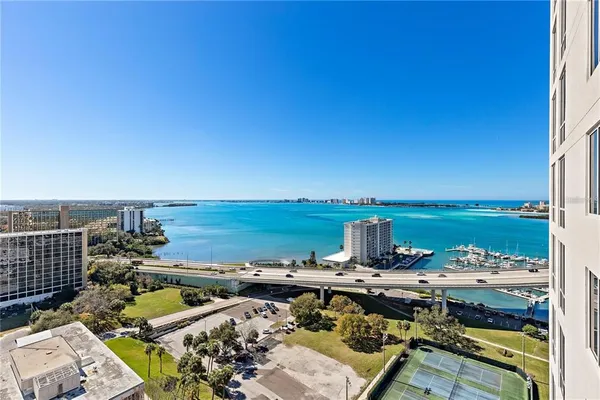 an aerial view of a city with ocean view