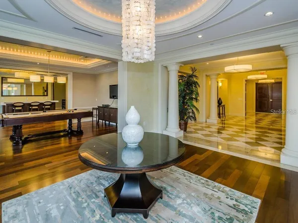 a living room with dining table a table and chairs