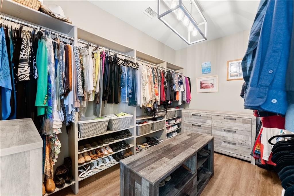 3476 Locust Cove Road Gainesville, GA 30504 - Photo 15 of 71 a view of walk in closet with clothes and shoes