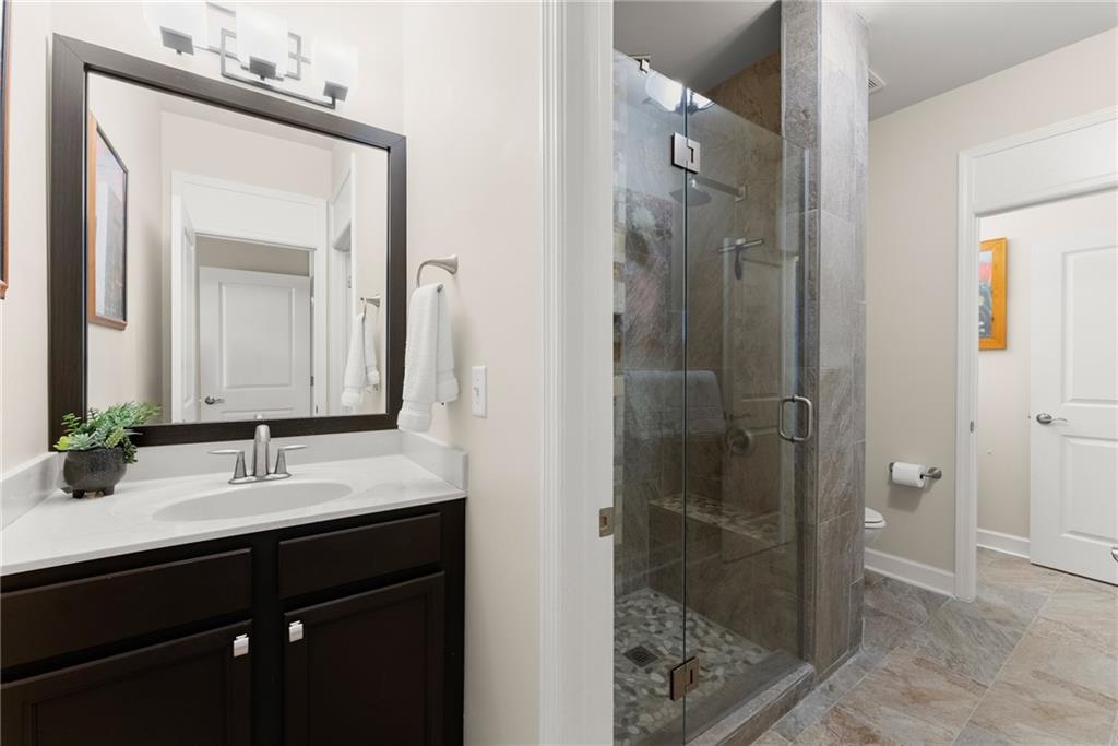 3476 Locust Cove Road Gainesville, GA 30504 - Photo 18 of 71 a bathroom with a sink and a mirror