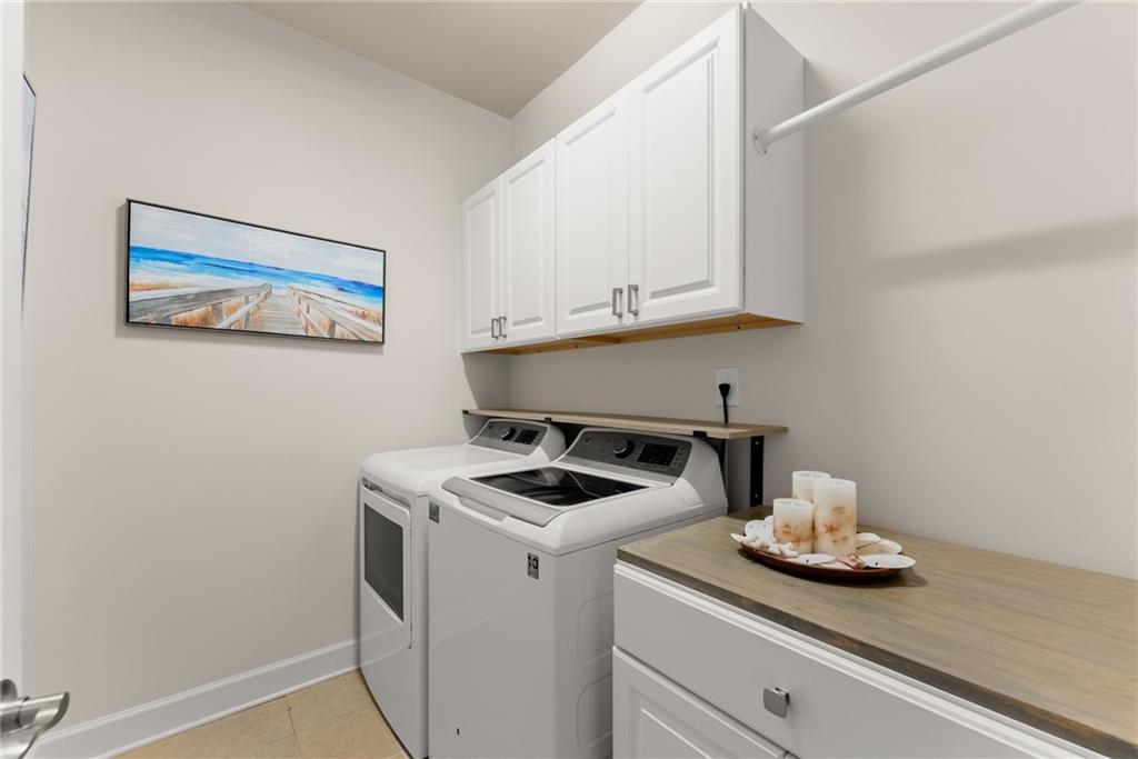 3476 Locust Cove Road Gainesville, GA 30504 - Photo 22 of 71 a kitchen with a stove and white cabinets