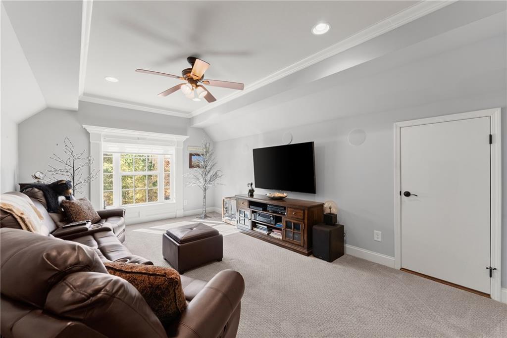 3476 Locust Cove Road Gainesville, GA 30504 - Photo 24 of 71 a living room with furniture and a flat screen tv