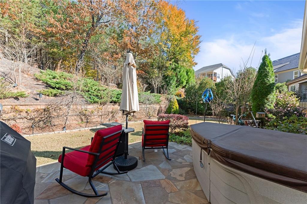 3476 Locust Cove Road Gainesville, GA 30504 - Photo 26 of 71 an outdoor sitting area with furniture and wooden floor